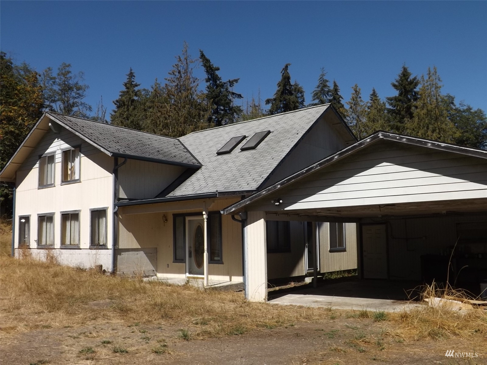 372 Olson Road Sequim, WA 98382 - Photo 1 of 22 a front view of a house with a yard