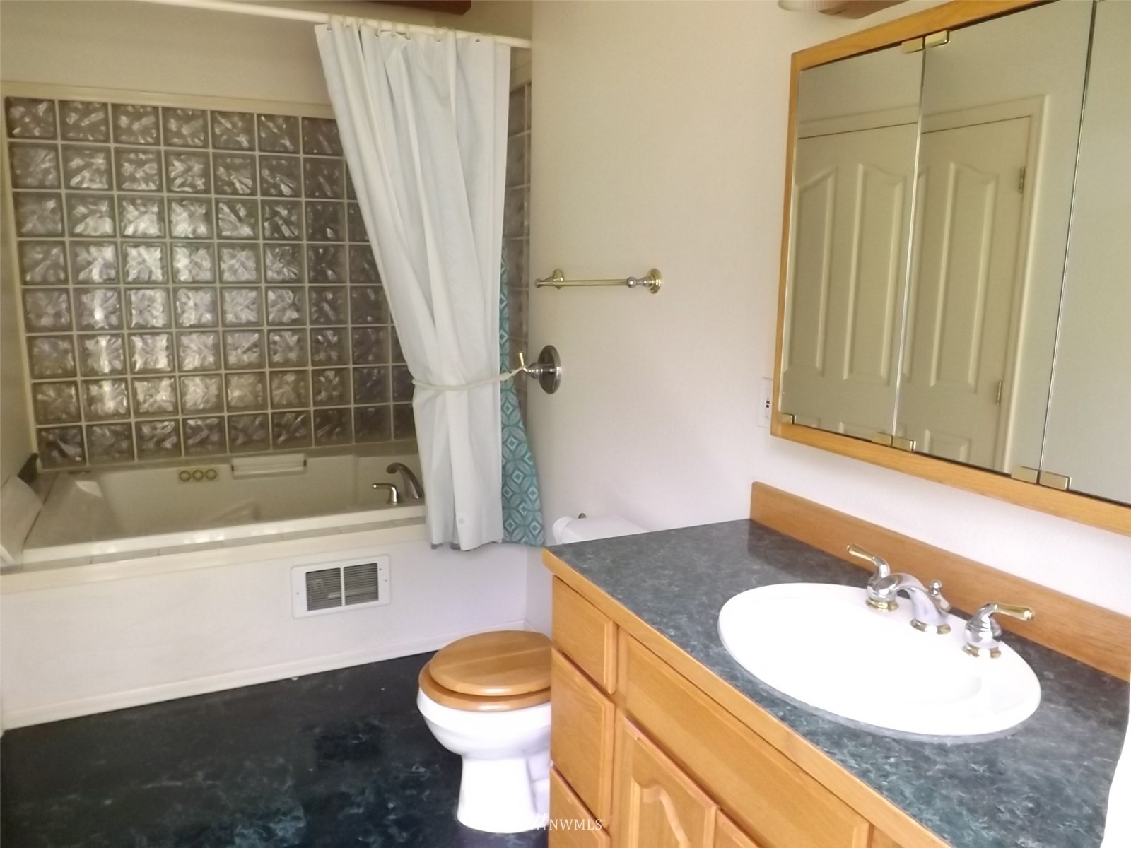 372 Olson Road Sequim, WA 98382 - Photo 14 of 22 a bathroom with a sink and a mirror