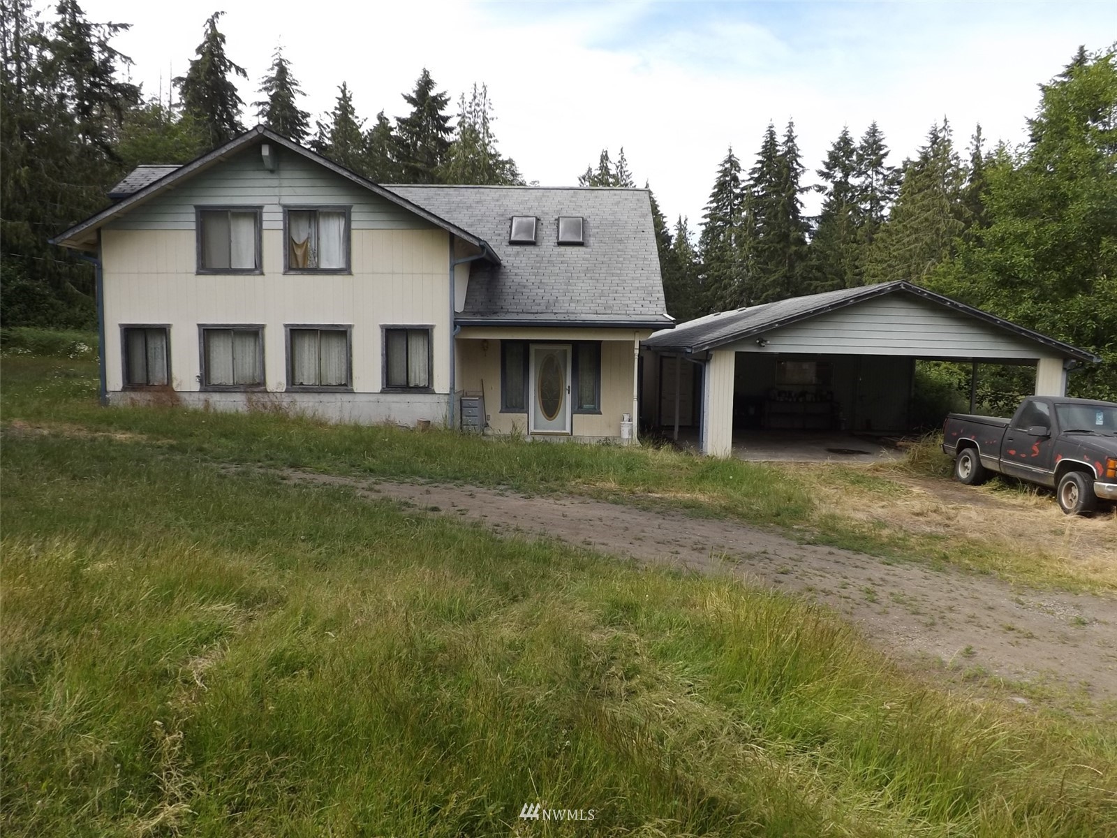 372 Olson Road Sequim, WA 98382 - Photo 3 of 22 a white house that has a tree in front of it