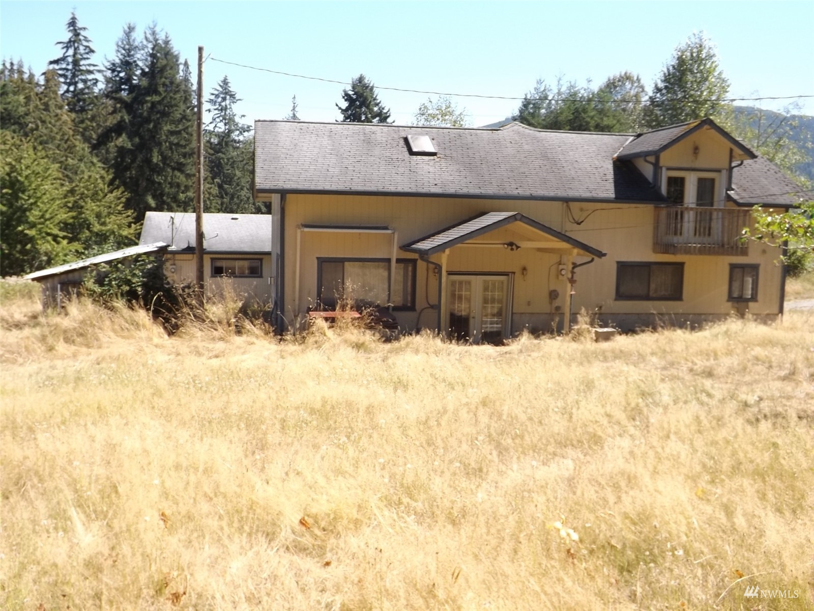372 Olson Road Sequim, WA 98382 - Photo 4 of 22 a view of house with a yard