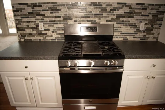 a view of a hallway with washer and dryer