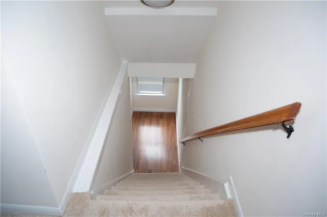 an empty room with wooden floor