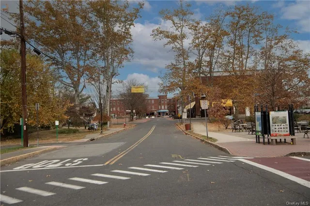 a view of street with parked cars