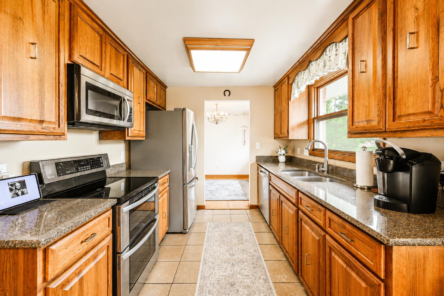 4428 Phoenix Drive Springfield, OH 45503 - Photo 10 of 35 Well appointed kitchen. Tons of granite covered counters and plenty of abundant cabinetry. All appliances to convey