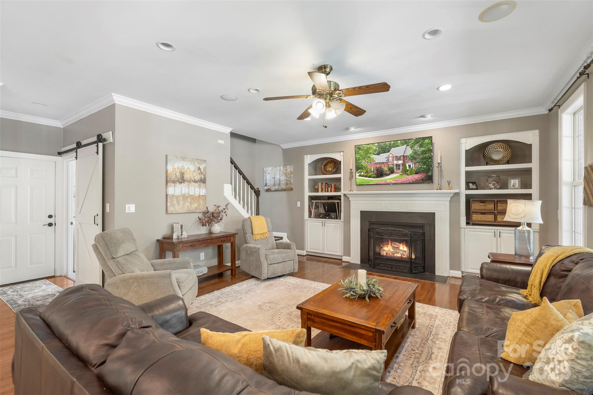 6006 Casswell Circle Matthews, NC 28104 - Photo 12 of 47 a living room with furniture and a fireplace