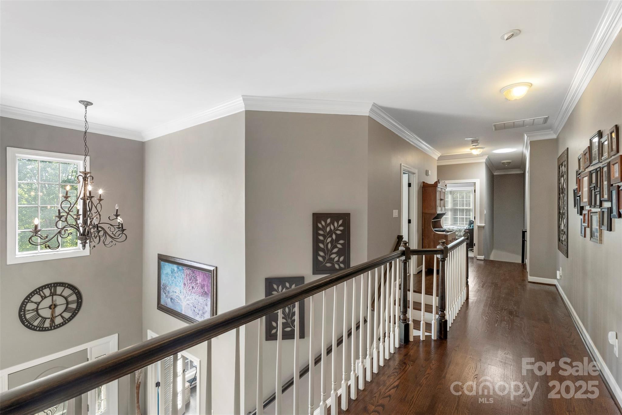 6006 Casswell Circle Matthews, NC 28104 - Photo 17 of 47 a view of a hallway with wooden floor