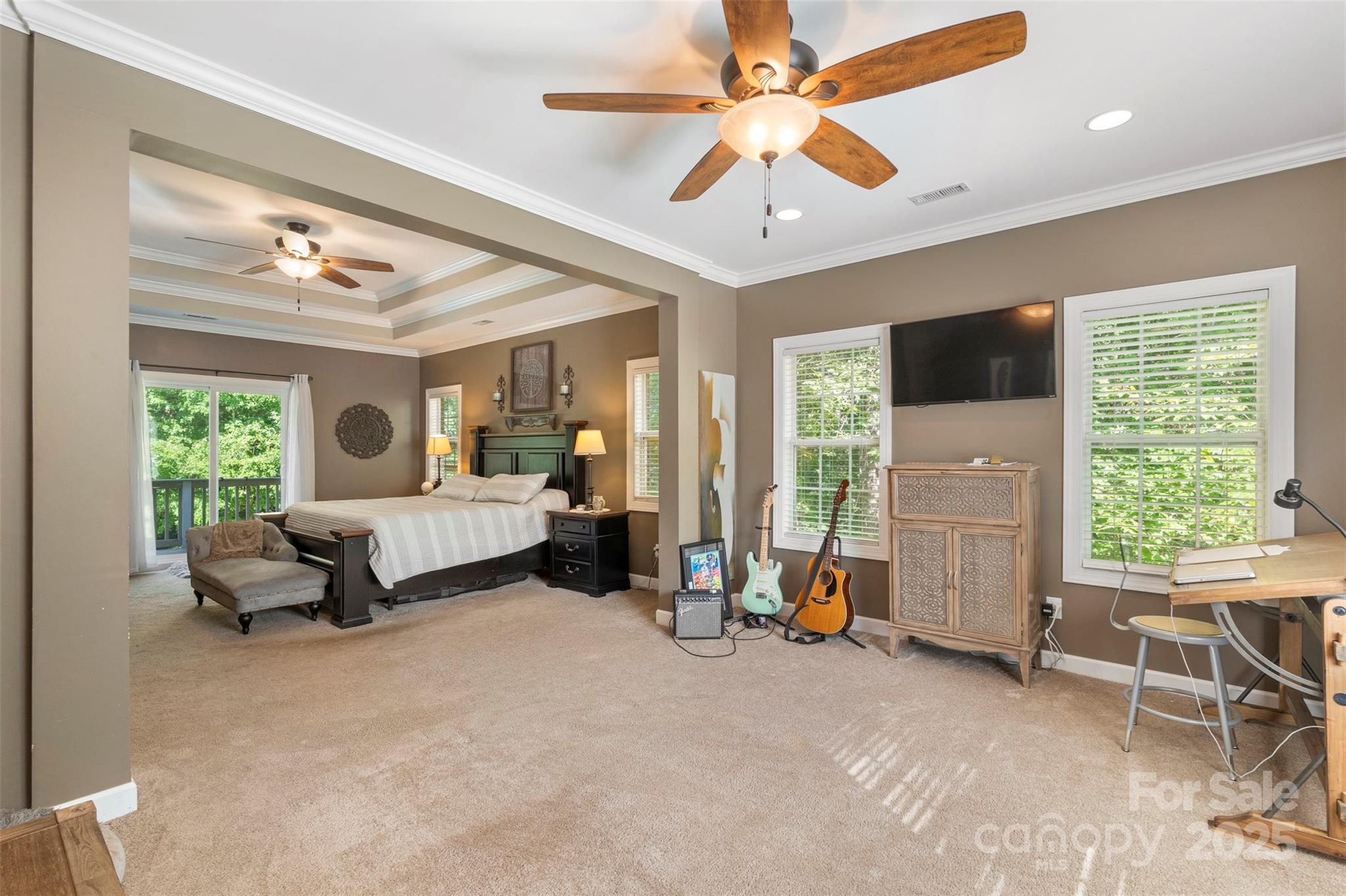 6006 Casswell Circle Matthews, NC 28104 - Photo 20 of 47 a spacious bedroom with a bed and a chandelier