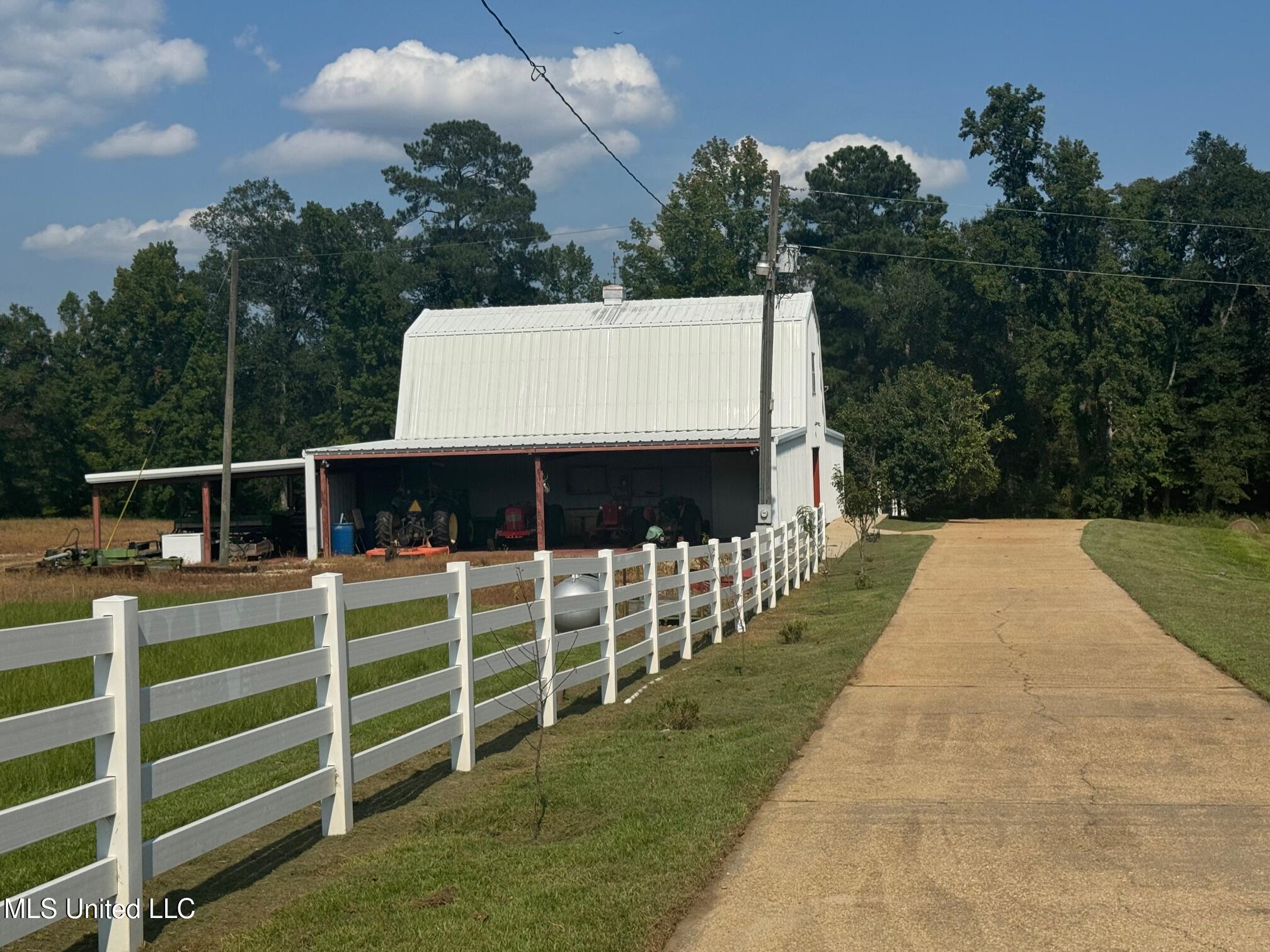 2053 Osyka Progress Road Osyka, MS 39657 - Photo 66 of 79 Concrete drive to barn