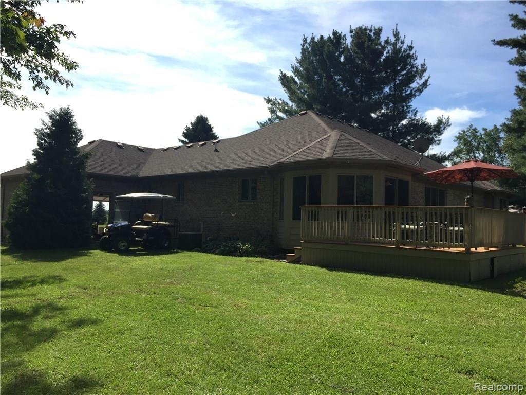 21325 24 Mile Road Macomb, MI 48042 - Photo 33 of 38 East side of the house, entry to garage.