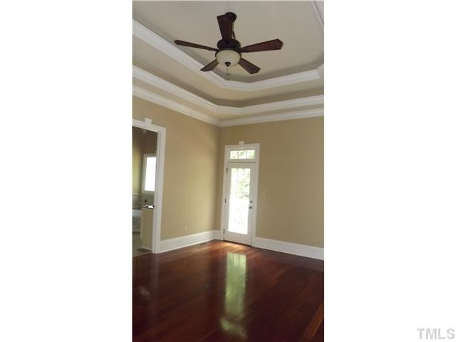 7329 Newport Avenue Raleigh, NC 27613 - Photo 15 of 17 a picture of a room with a window and a ceiling fan