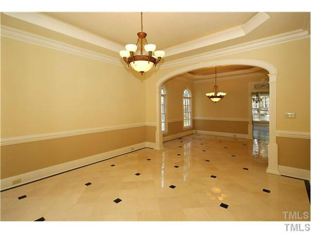 7329 Newport Avenue Raleigh, NC 27613 - Photo 3 of 17 a view of a hallway with chandelier