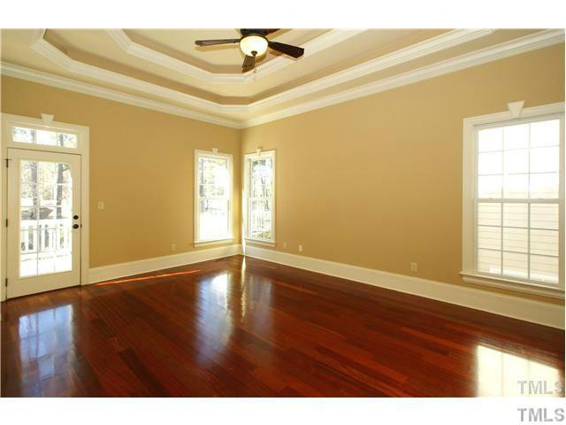 7329 Newport Avenue Raleigh, NC 27613 - Photo 6 of 17 a view of an empty room with wooden floor and a window