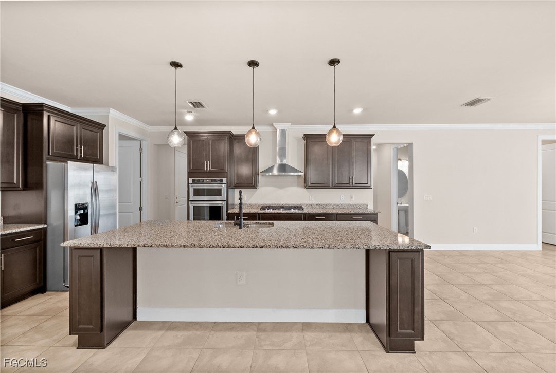 42346 Waterfront Way Punta Gorda, FL 33982 - Photo 12 of 46 a large kitchen with kitchen island a counter top stainless steel appliances and cabinets