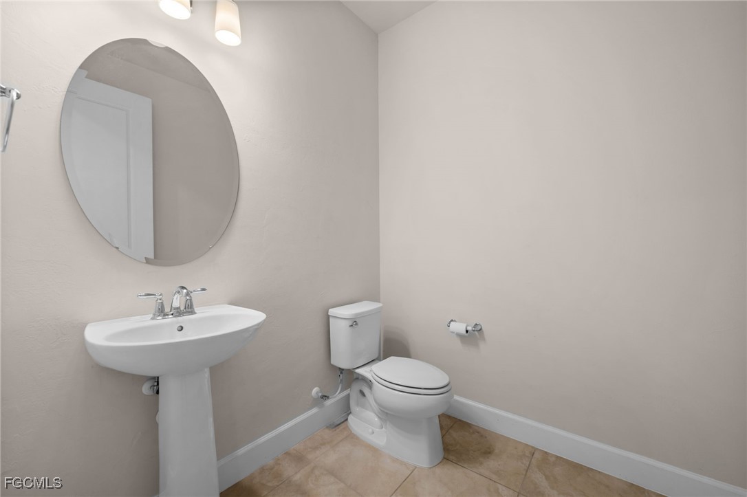 42346 Waterfront Way Punta Gorda, FL 33982 - Photo 20 of 46 a bathroom with a sink toilet and a mirror