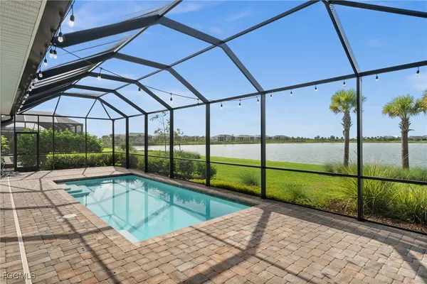 a view of a swimming pool with a porch