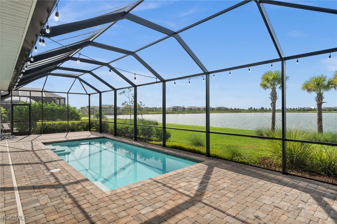42346 Waterfront Way Punta Gorda, FL 33982 - Photo 3 of 46 a view of a swimming pool with a porch