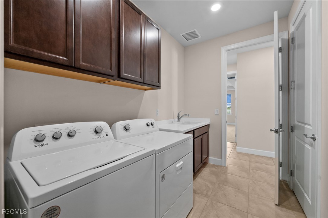 42346 Waterfront Way Punta Gorda, FL 33982 - Photo 32 of 46 a utility room with dryer and washer