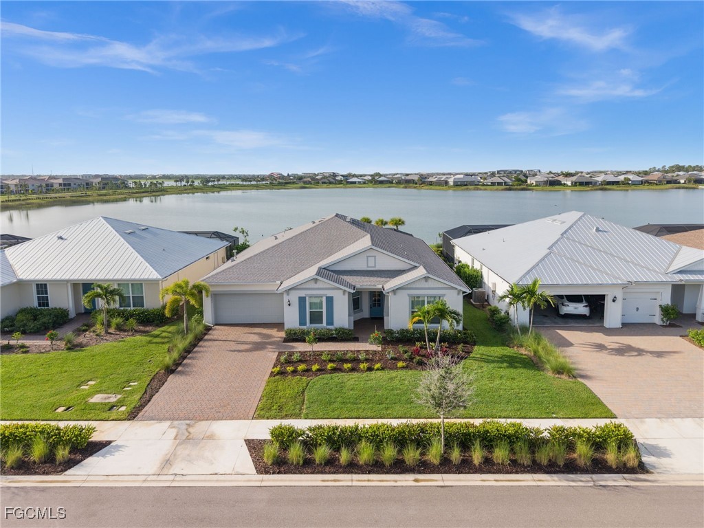 42346 Waterfront Way Punta Gorda, FL 33982 - Photo 39 of 46 a front view of a house with a yard and lake view