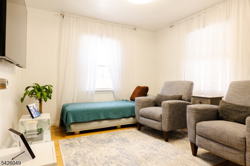 502 Atlas Road Landing, NJ 07850 - Photo 14 of 27 a living room with furniture and a potted plant