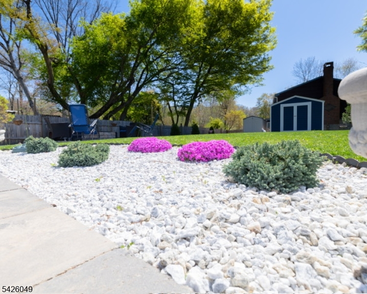 502 Atlas Road Landing, NJ 07850 - Photo 21 of 27 a view of a backyard with plants and large tree