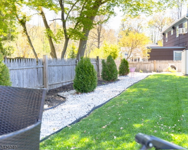 502 Atlas Road Landing, NJ 07850 - Photo 22 of 27 a view of a backyard with a tree