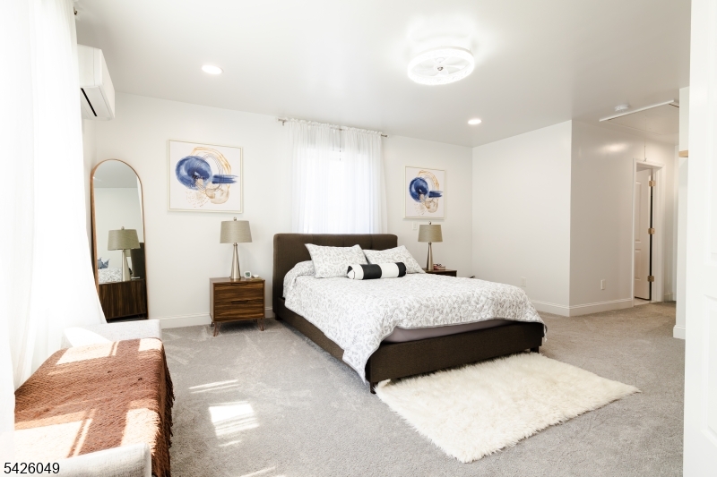 502 Atlas Road Landing, NJ 07850 - Photo 6 of 27 a bedroom with a bed and a couch