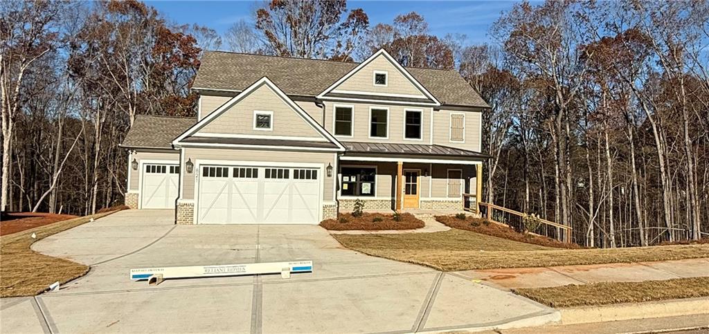 a view of a white house with a trees in front of it