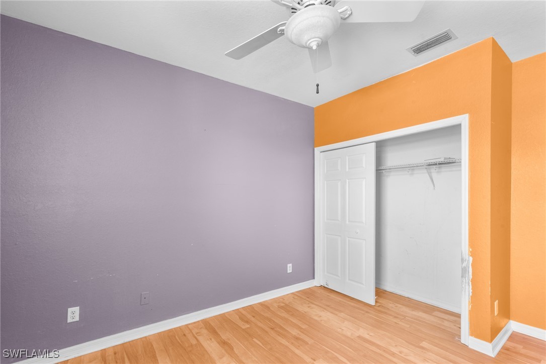 4031 Cherrybrook Loop Fort Myers, FL 33966 - Photo 16 of 34 a view of an empty room with wooden floor