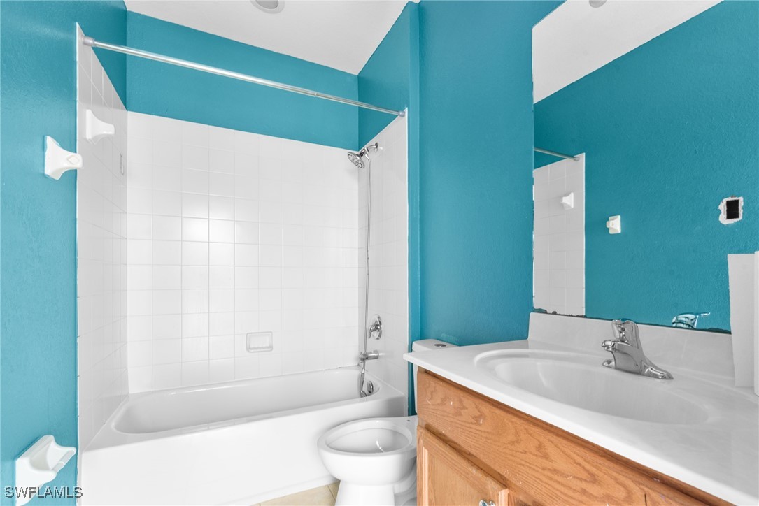 4031 Cherrybrook Loop Fort Myers, FL 33966 - Photo 17 of 34 a bathroom with a sink a toilet and shower