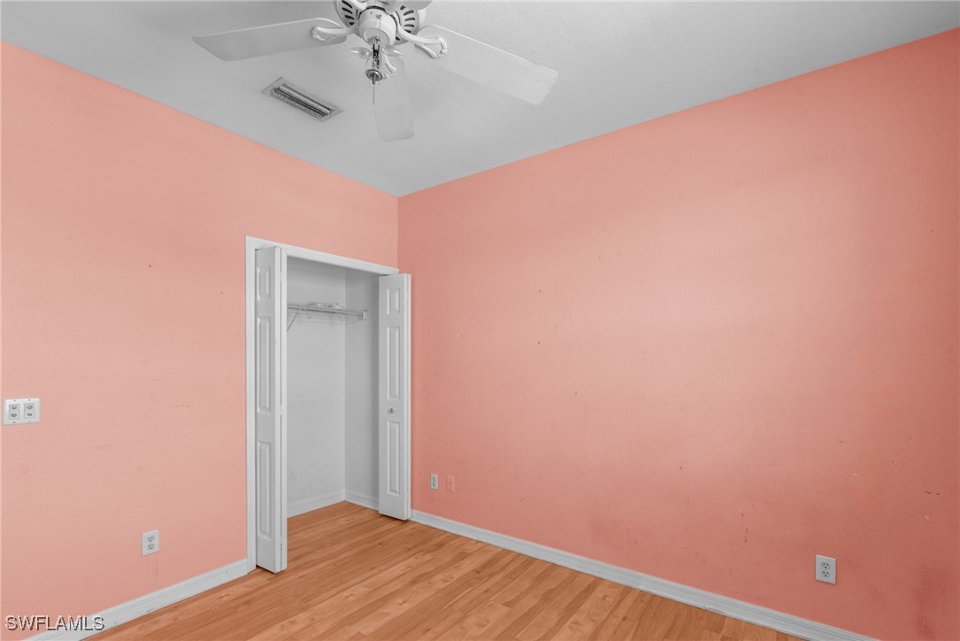 4031 Cherrybrook Loop Fort Myers, FL 33966 - Photo 19 of 34 wooden floor in an empty room