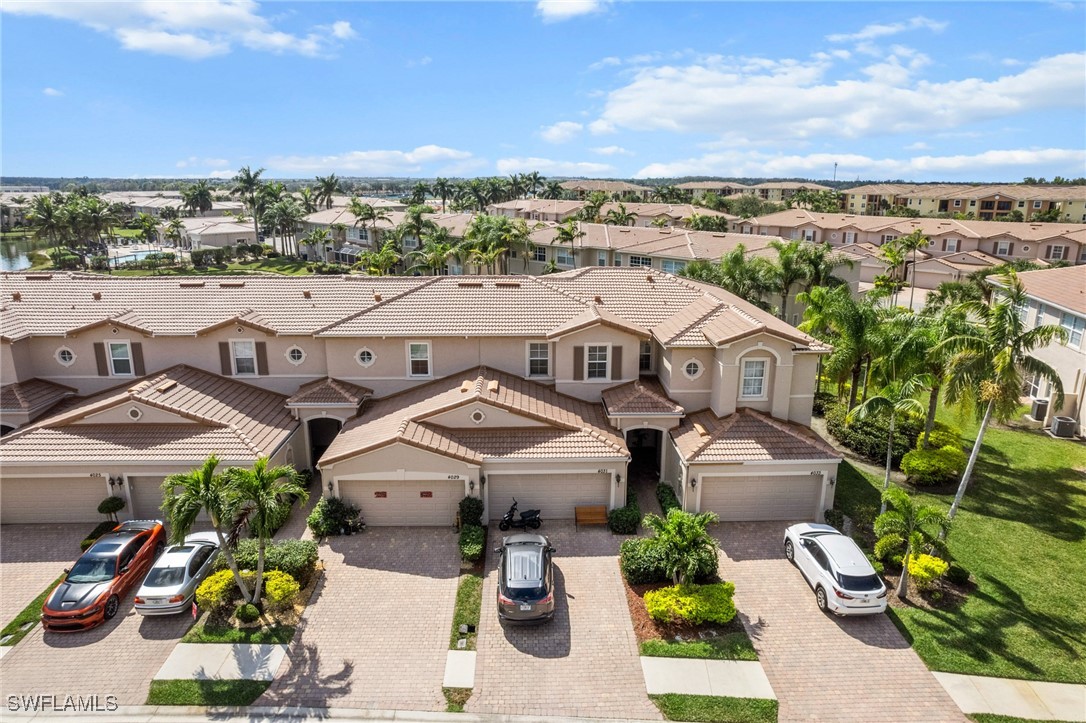 4031 Cherrybrook Loop Fort Myers, FL 33966 - Photo 24 of 34 an aerial view of a house with a yard