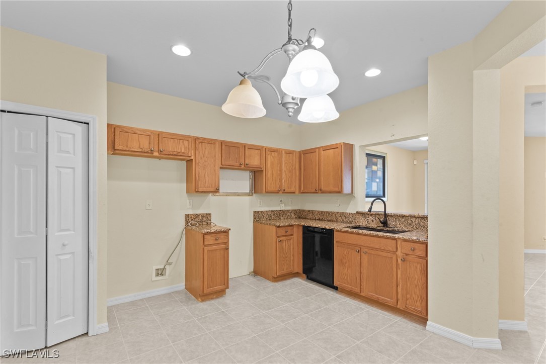 4031 Cherrybrook Loop Fort Myers, FL 33966 - Photo 3 of 34 a kitchen with cabinets and window