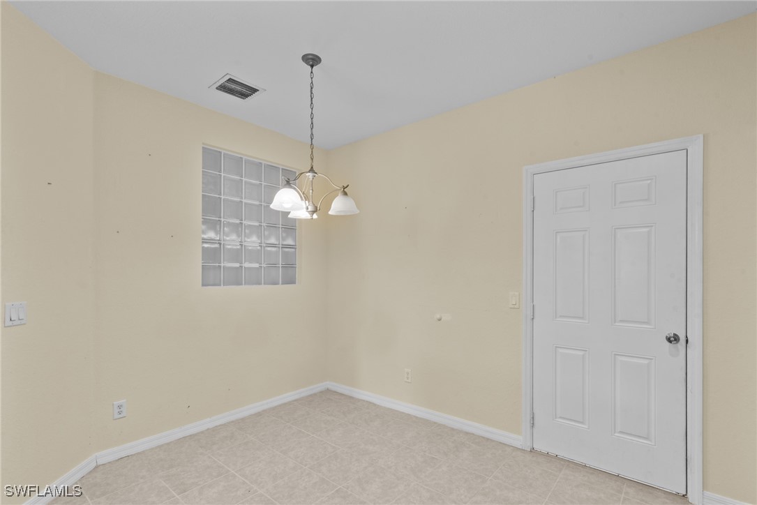 4031 Cherrybrook Loop Fort Myers, FL 33966 - Photo 4 of 34 a view of a room with a ceiling fan and a window