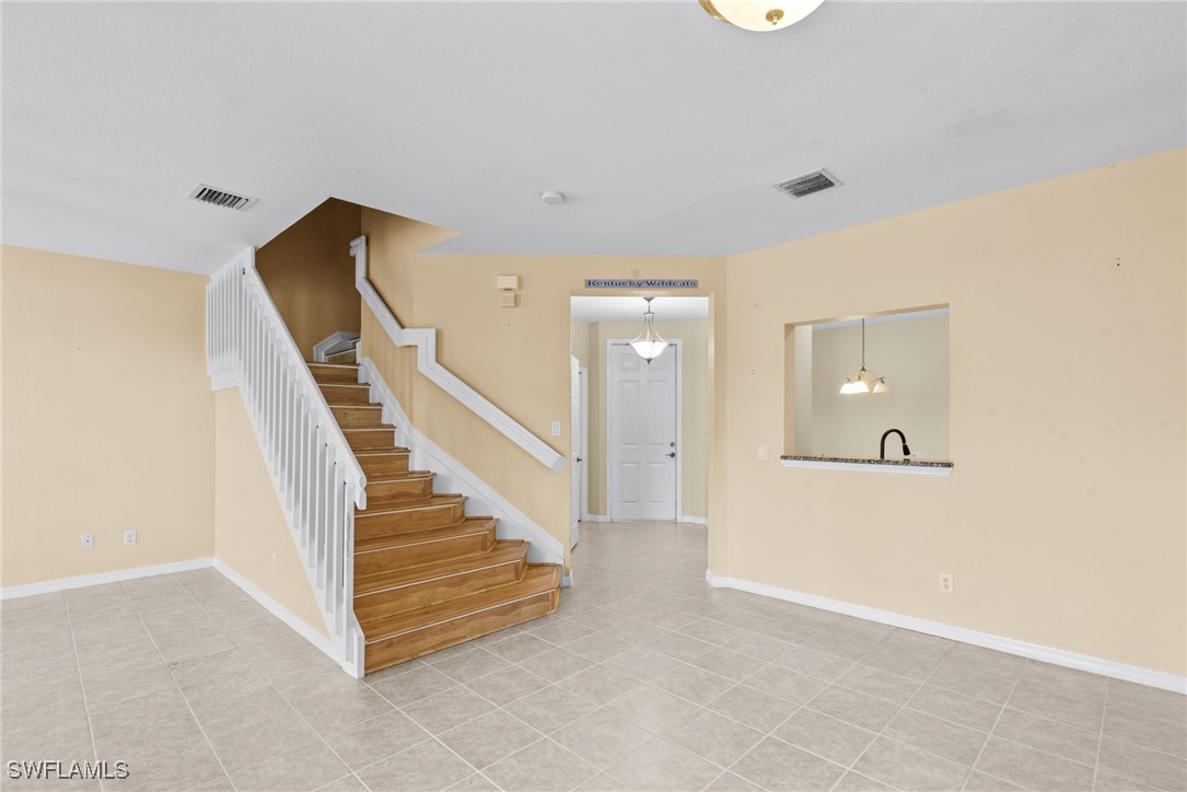4031 Cherrybrook Loop Fort Myers, FL 33966 - Photo 7 of 34 a view of a hallway with staircase