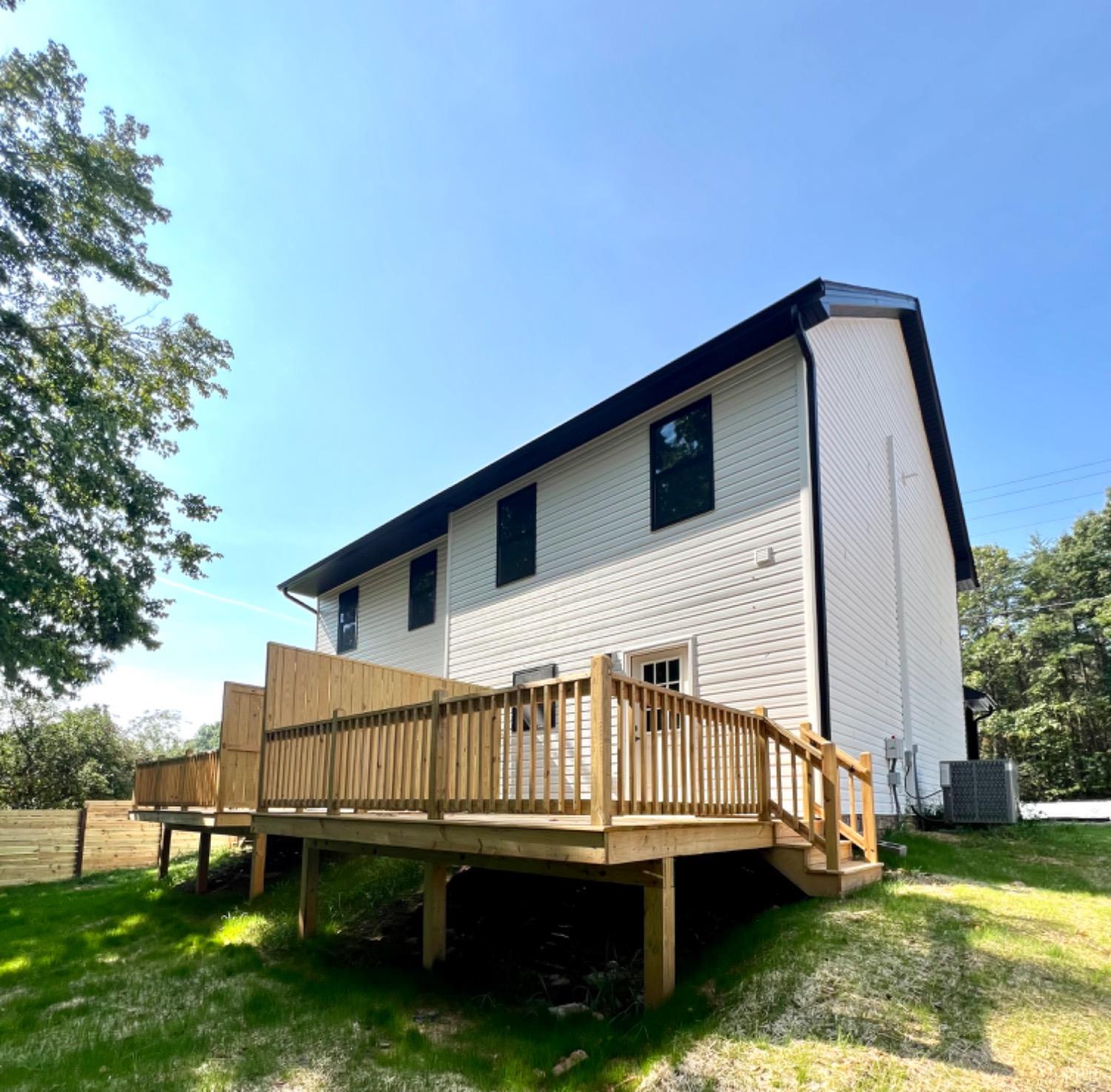2638 Sunnymeade Road, Unit A&B Rustburg, VA 24588 - Photo 24 of 25 a view of a house with a wooden deck and a yard