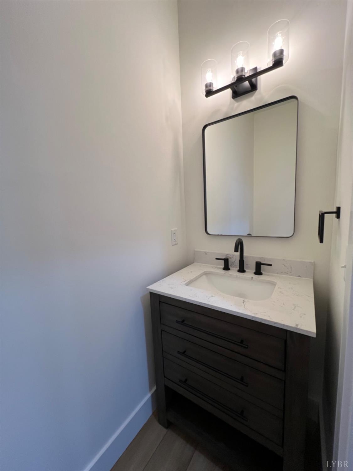 2638 Sunnymeade Road, Unit A&B Rustburg, VA 24588 - Photo 8 of 25 a bathroom with a sink vanity and a mirror