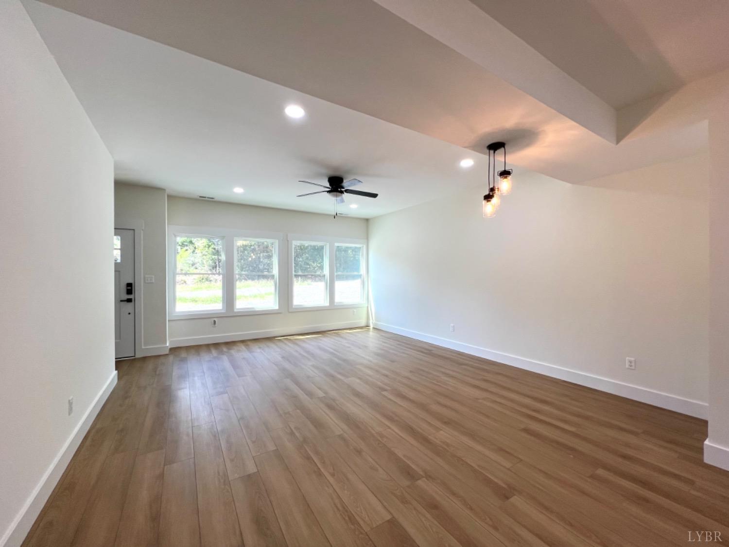 2638 Sunnymeade Road, Unit A&B Rustburg, VA 24588 - Photo 10 of 25 wooden floor in an empty room with a window