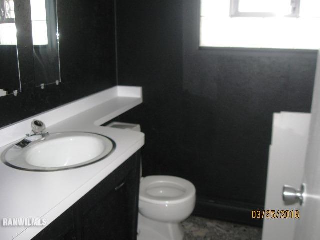 2055 Hillsdown Road Davis, IL 61019 - Photo 12 of 18 a bathroom with a sink toilet and a mirror
