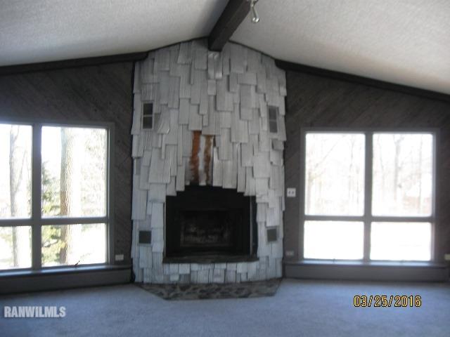 2055 Hillsdown Road Davis, IL 61019 - Photo 3 of 18 a living room with a fireplace and a window