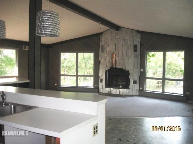 2055 Hillsdown Road Davis, IL 61019 - Photo 5 of 18 a view of an empty room with a window and a fireplace