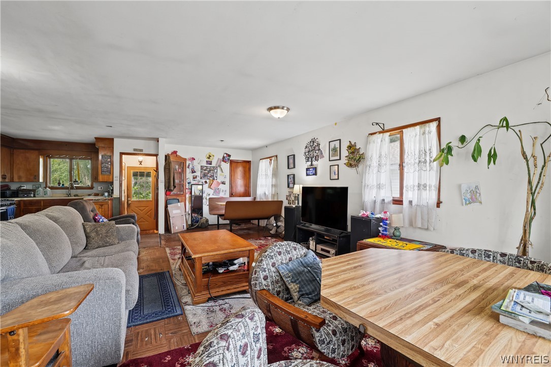 8435 Rochester Road Royalton, NY 14067 - Photo 4 of 27 Hardwood flooring flows throughout this flexible o