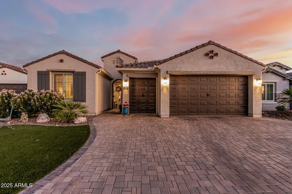 a front view of a house with a garage