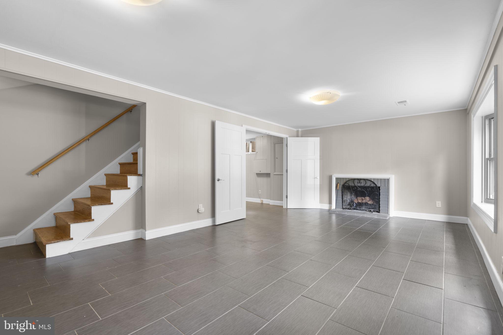 822 Loxford Terrace Silver Spring, MD 20901 - Photo 42 of 61 a view of an empty room with wooden floor and a window