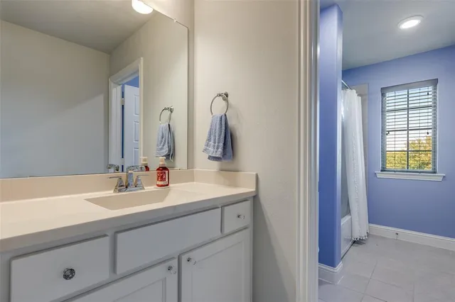 a bedroom with a bed and a television