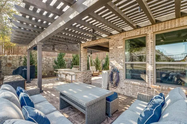 a outdoor living space with patio furniture and a garden