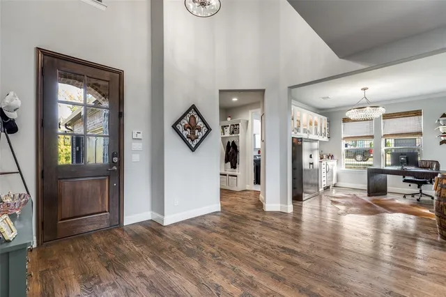 a view of a kitchen with furniture and wooden floor