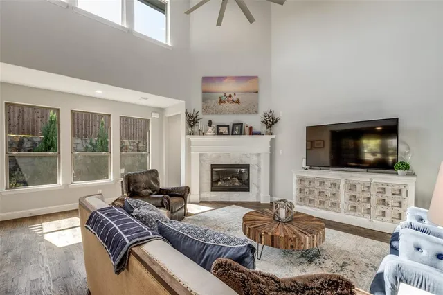 a view of a livingroom with workspace and a window