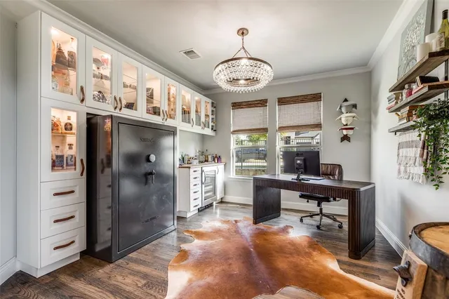 a large kitchen with kitchen island a sink table and chairs