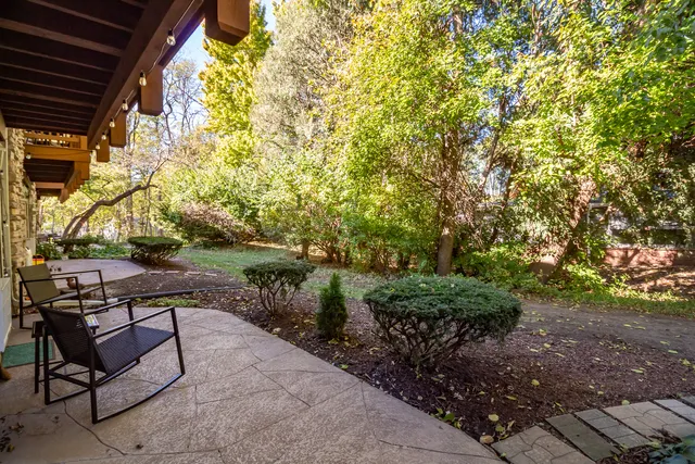 a view of a backyard with sitting area