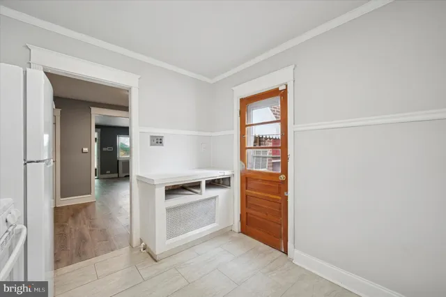 a view of kitchen and wooden floor